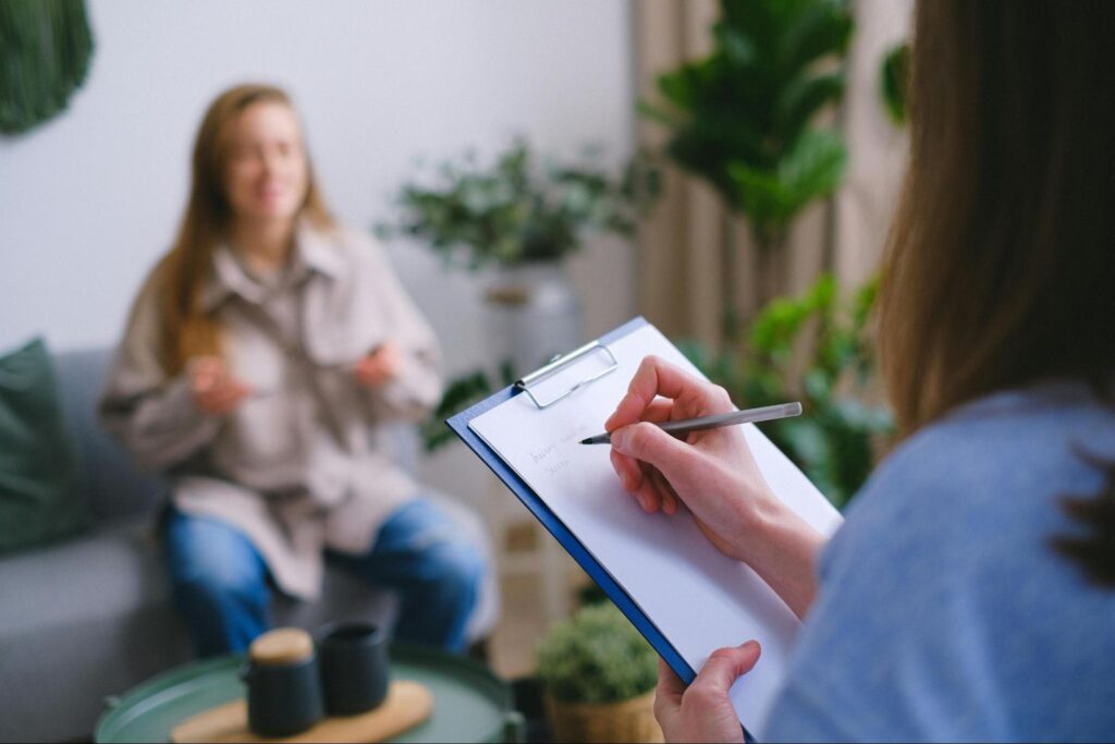 A behavioral health specialist listens to a patient in a safe and welcoming environment