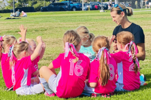 Mrs. Binette with her daughter's soccer team